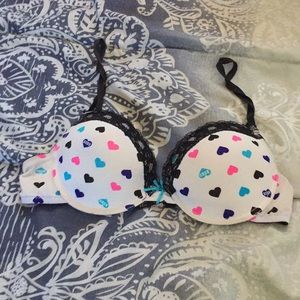 White bra with black blue and pink hearts